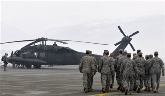 A U.S. helicopter sits at Podgorica airport, Montenegro, on Wednesday, ready to join rescue operations in areas of the tiny Balkan state hit by the heaviest snowfall in 60 years.